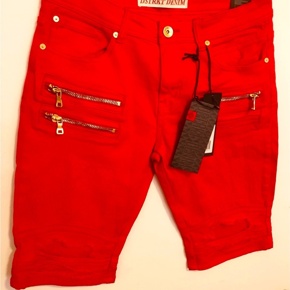 Denim red relax cut shorts with rips and gold accents..